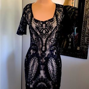 DRESS COCKTAIL OR PARTY. NUDE LINING WITH BLACK LACE OVERLAY FRINGE BOTTOM